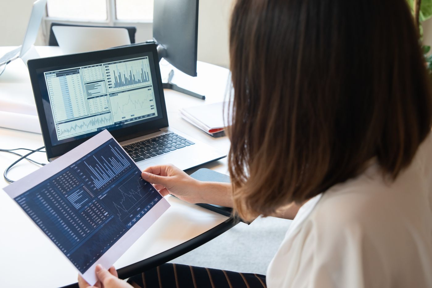 A SpakClean analyst reviewing a Power BI report with a client